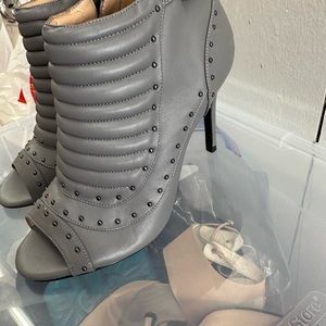 Gray peep toe bootie. Easy to get on/off. 3 1/2” heel. Never worn.